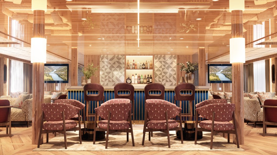 Warm-lit bar lounge featuring a blue-front bar, wooden columns, brown high stools, and pink patterned chairs around tables.