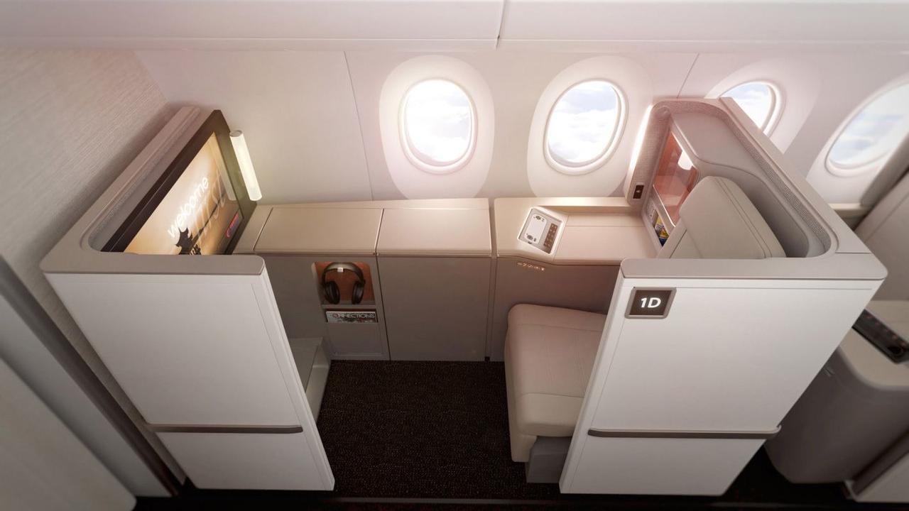 Premium airplane seat in a private first-class/business suite labeled 1D, with a single wide seat, window views, and a built-in screen and storage along the cabin wall.